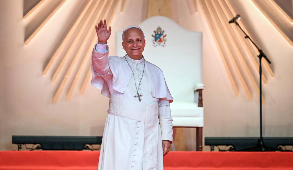 Pope Leo XIV waves at the crowd during a meeting with young people and families at Bata Stadium in Bata on the tenth day of an 11-day apostolic journey to Africa, on April 22, 2026. (Photo by Alberto PIZZOLI / AFP)