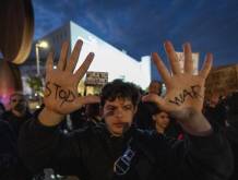TEL AVIV, ISRAEL - MARCH 07: People protest the US-Israeli attacks on Iran, carrying banners that read 'Justice for Gaza' and 'Stop the war' in Tel Aviv, Israel on March 07, 2026