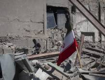 An unidentified man works among the ruins of a police station that is struck during U.S.-Israeli attacks in Tehran, Iran, on March 3, 2026. (Photo by Morteza Nikoubazl/NurPhoto) (Photo by Morteza Nikoubazl / NurPhoto via AFP)