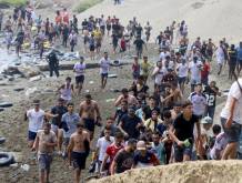 epa13141875 Migrants reach Spanish territory after swimming from Morocco to Ceuta, a Spanish enclave in North Africa, 30 July 2026. Hundreds of migrants swam to cross the border to Ceuta over the last nine days, mainly Moroccan and Algerian. Ceuta officials asked the Spanish government to declare a 'national emergency.' EPA/Reduan Dris BEST QUALITY AVAILABLE
