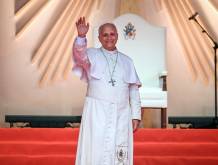 Pope Leo XIV waves at the crowd during a meeting with young people and families at Bata Stadium in Bata on the tenth day of an 11-day apostolic journey to Africa, on April 22, 2026. (Photo by Alberto PIZZOLI / AFP)