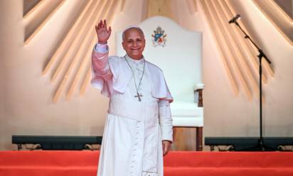 Pope Leo XIV waves at the crowd during a meeting with young people and families at Bata Stadium in Bata on the tenth day of an 11-day apostolic journey to Africa, on April 22, 2026. (Photo by Alberto PIZZOLI / AFP)